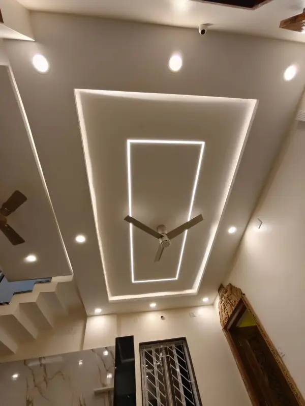 Sarjapur Road home interior – false ceiling design with layered gypsum board and LED cove lighting by Prestige Craft Interiors